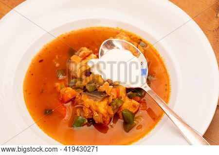 Halaszle, Hungarian Fishermans Soup Or Fish Stew With Carp, Bell Peppers, Paprika And Sour Cream