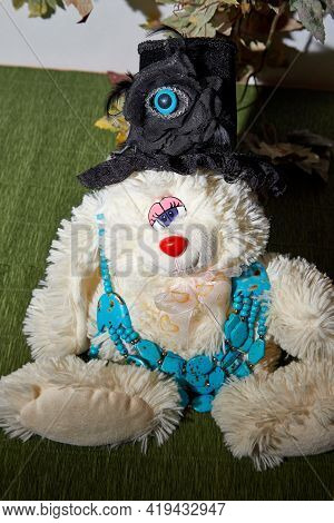 Beautiful Blue Beads And Funny Rabbit On A Green Surface