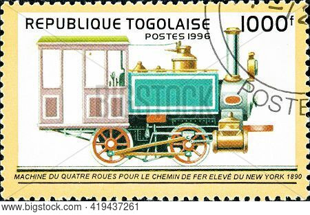 Togo - Circa 1996: A Stamp Printed In Togo Shows An Old Four-wheel Locomotive Designed For The New Y