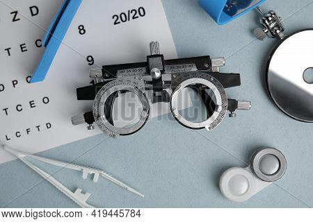 Different Ophthalmologist Tools On Grey Background, Flat Lay