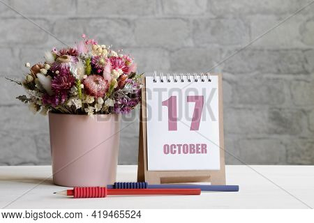 October 17. 17-th Day Of The Month, Calendar Date.a Delicate Bouquet Of Flowers In A Pink Vase, Two 