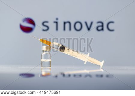 Sinovac Coronavirus Vaccine Vial And Syringe With Logo As Background. Ljubljana, Slovenia: March 25,