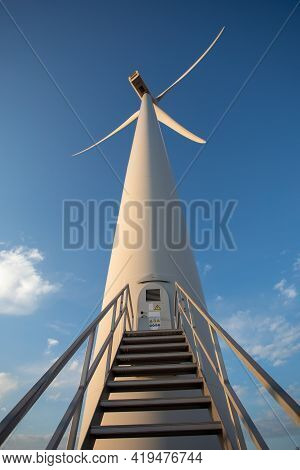 Wind Turbine Genarating Electricity With Blue Sky