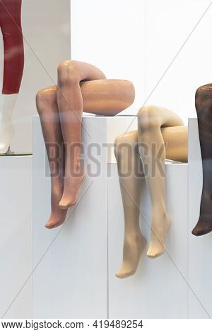 Mannequins Legs In Shop Window. Tights. Hosiery Shop. Vertical Frame.
