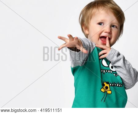 Little Smiling Preschool Toddler Boy European Ethnicity Wearing Trendy Green Raglan With Cute Monste