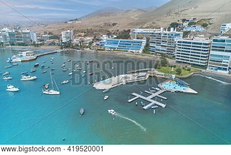 Aerial View Of The Bay, Marina And Buildings Of Ancon - Lima, Peru; Summer Area, The Beach And Some 