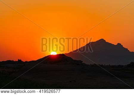 Sun Rise From Behind The Aravalli Mountain Ranges Seen As Silhouette From Jawai Bandh In Rajasthan I