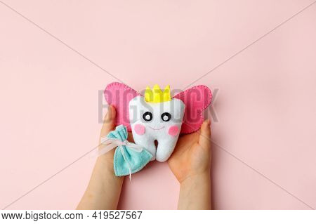 Little Child Holding Felt Tooth Fairy Toy In His Hands On Pink Background. Easy And Funny Kids Craft