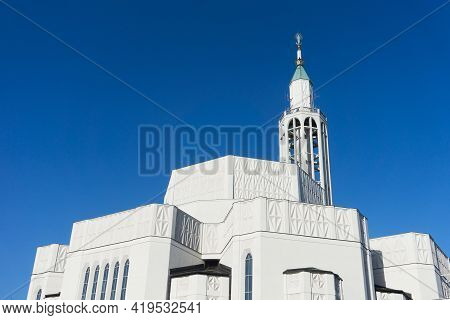 Saint Roch Church In Bialystok City In Poland. White Catherdal Building. Empty Copy Space Blue Sky. 