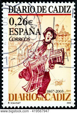 Spain - Circa 2003: A Stamp Printed In The Spain Shows A Newspaper Vendor Offering The Cadiz Newspap