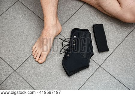 The Male Leg Is Fixed In A Medical Bandage. Ankle Fracture Or Sprain. Lacing And Tight Fit Of The Fo