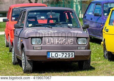 Daugmale, Latvia - May 01, 2021: Several Colorful Oldtimer Rental Cars Fiat 126 On The Lawn Of The P
