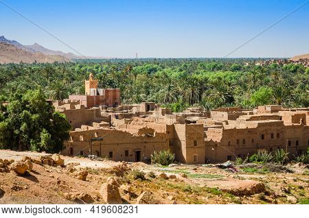 Aoufous, Morocco - April 17, 2015. Traditional Muddy Houses By Palm Oasis Around River Ziz