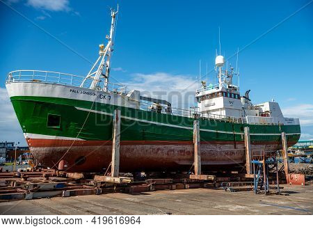 Reyklavik, Iceland - July 28, 2017: An Old Fishing Boat In A Dry Dock For Maintenance And Repair