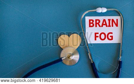 Medical, Covid-19 And Brain Fog Symbol. White Card With Words 'brain Fog' And Stethoscope On Blue Ba
