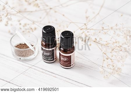 Dobrush, Belarus - October 27, 2019: Natural Henna Powder In Bottles With Inscription Grafix And Eye