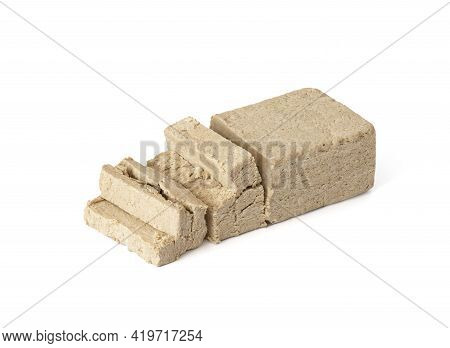 Sliced Halva Isolated On A White Background. Traditional Oriental Dessert. Vegan Food.