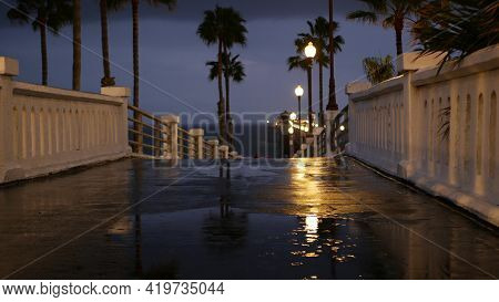 Rain Drops, Evening Dark Sky With Clouds, Oceanside California Usa. Empty Pier, Puddle, Palms In Twi