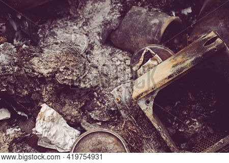 Burnt Trash. Remains Of Burnt Garbage. Household Waste. Waste Disposal. Garbage In The Barrel. Dispo