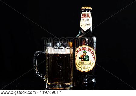 Can Of Birra Morreti Beer And Beer Glass On Dark Background. Illustrative Editorial Photo Shot In Bu