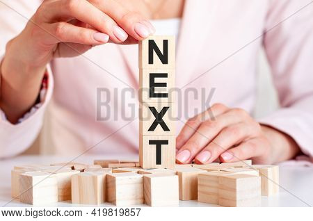 Four Wooden Cubes With Letters Next, Concept