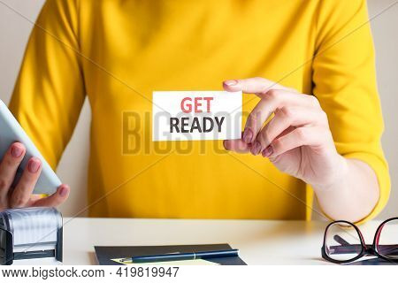 Businesswoman Holding A Card With Text Get Ready, Concept