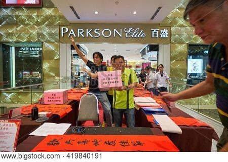 KUALA LUMPUR, MALAYSIA - CIRCA JANUARY, 2020: people posing at Pavilion Kuala Lumpur shopping centre.