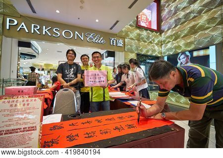 KUALA LUMPUR, MALAYSIA - CIRCA JANUARY, 2020: people posing at Pavilion Kuala Lumpur shopping centre.