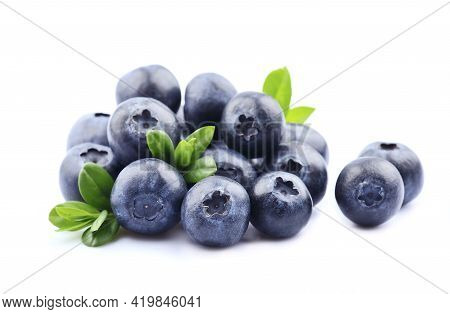 Sweet Blueberries With Leaves On White Backgrounds.