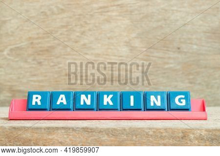 Tile Alphabet Letter With Word Ranking In Red Color Rack On Wood Background