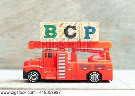 Fire Ladder Truck Hold Letter Block In Word Bcp (abbreviation Business Continuity Plan) On Wood Back