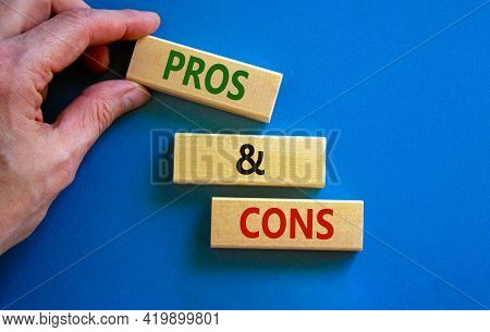 Pros And Cons Symbol. Wooden Blocks With Words 'pros And Cons'. Beautiful Blue Background, Businessm
