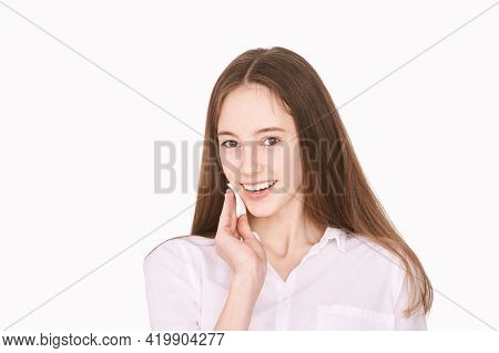 Pretty Girl Indoor Portrait. Light Background. Female Teenager Person. Long Brow Hair. Cleansing Dir