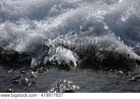 Ice On The River, Stream Froze. Cold Season. Mountain Stream Stones. Thaw Spring Snow.  Ice Started 