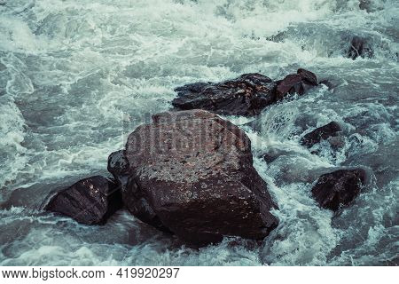 Atmospheric Nature Background With Giant Stones In Mountain River. Big Rocks In Powerful Water Strea