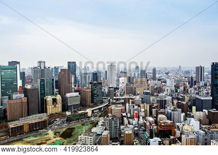 Osaka, Japan - 18 May, 2015: View From Above On Osaka City With Skyline With Skycrapers, Highways An