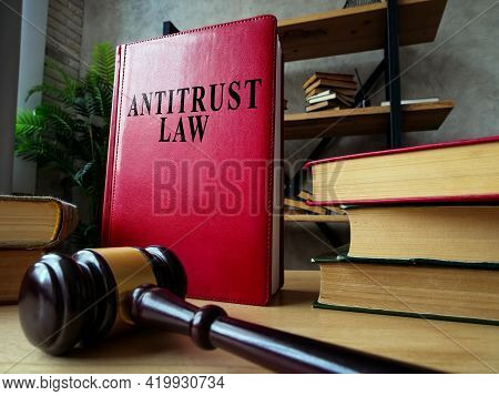 Antitrust Law And Stack Of Documents With Gavel.