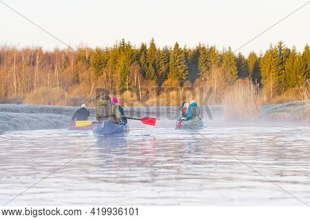 Family Canoeing On The River In The Early Morning. Joint Pastime, Entertainment, Outdoor Recreation,