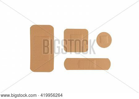 Top View Different Medical Plaster Isolated On A White Background. Medical Sticking Patch Isolated O