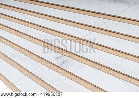 A Stack Of Laminate Flooring. Laminate Flooring Panels Background Texture. Laminate Background. Wood