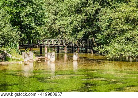 Wooden Bridge At The Source Of The River Bosna Near The City Of Sarajevo.