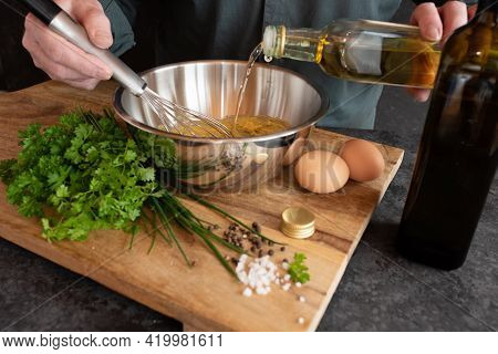 Preparing A Gribiche Sauce For Green Asparagus. Hands Prepare Fresh Ingredients For A Tasty Side Dis