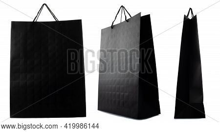 Black Paper Bag Isolated On White Background. Side, Front, Three-quarter View.