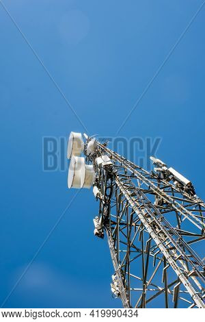 Radio, Communication And Cell Tower On Blue Sky Background