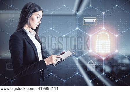 Businesswoman Standing With A Mobile Phone In An Office With A Keylock Hologram, Data Safety And Cyb