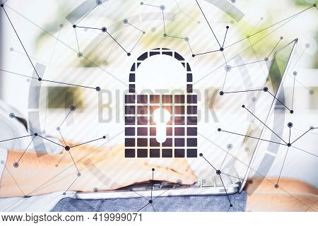 Black Keylock Hologram On A Bright Background With Hands Typing On The Laptop Closeup, Data Safety A