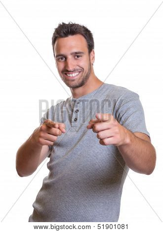 Young man pointing with both hands
