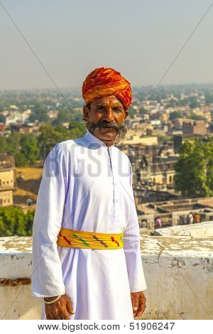 Rajasthani Man With Bright Red Turban And Bushy Mustache Poses For Tourists