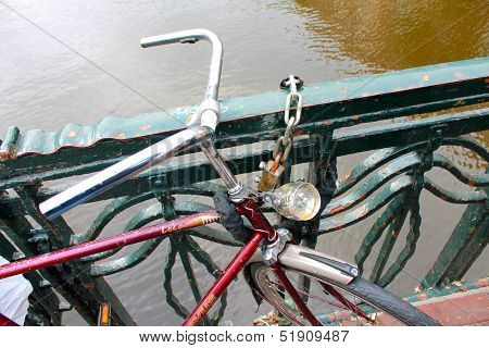 Bicycle On The Bridge Of Amsterdam
