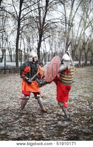 MOSCOW - APRIL 28: Duel of east warriors in armor on Maneuvers East versus West, on April 28, 2013 in Moscow, Russia. Prototype of maneuvers East vs. West  served Battle of Grunwald.